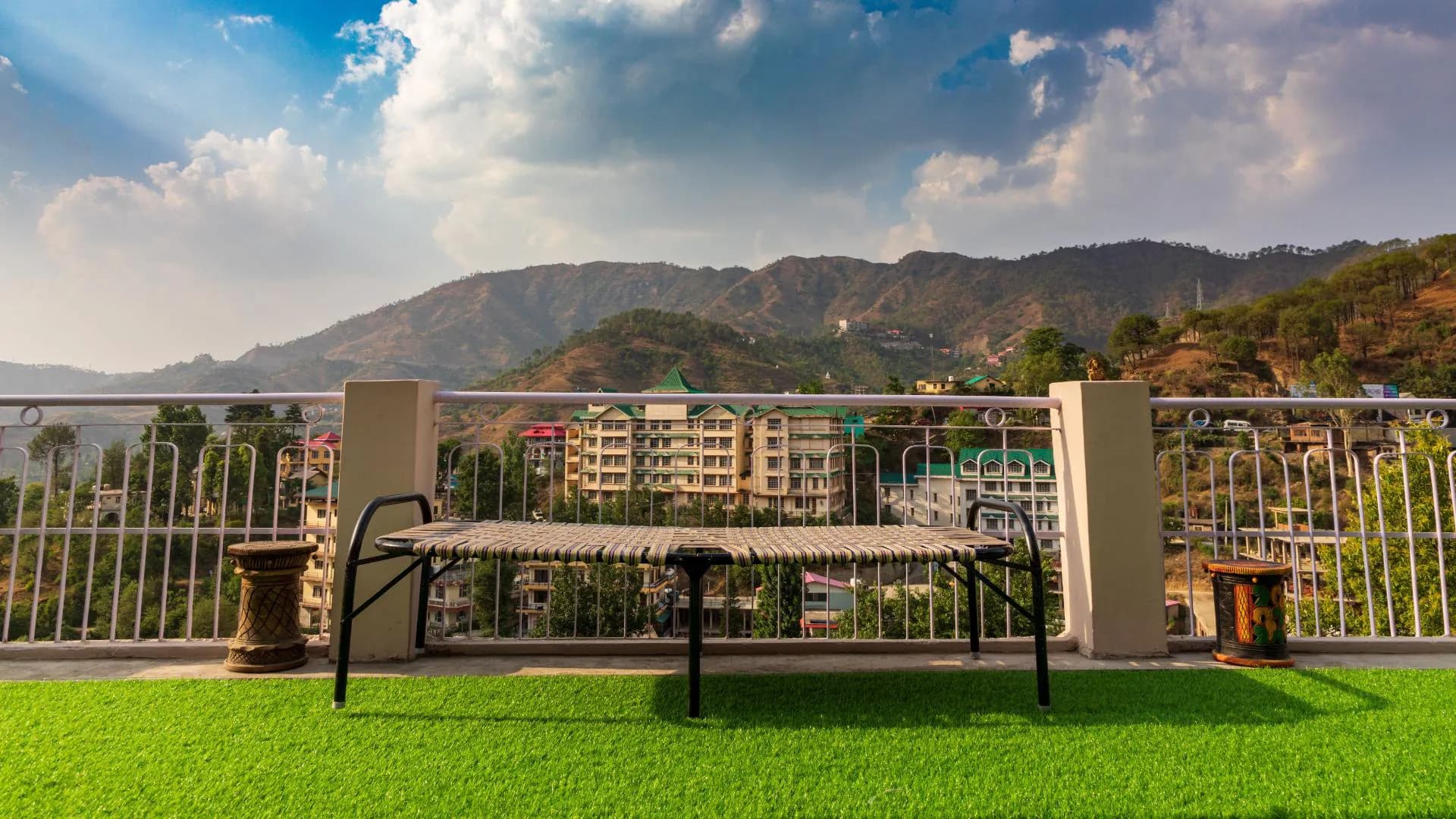 Relaxing on the terrace charpai with breathtaking mountain vistas